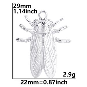 Macro view of stainless steel cicada pendant showing 29mm height and 22mm width
