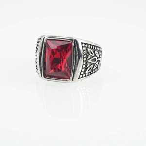 Vintage steel ring with a large rectangular red gemstone and side leaf patterns
