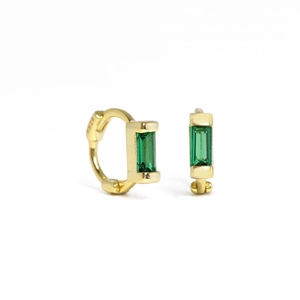 Macro shot of S925 sterling silver gold hoop earring featuring a green rectangular gemstone