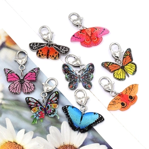 Eight-piece acrylic butterfly keychain set with vintage prints and heart lobster clasps
