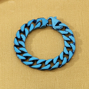 Detail of blue electroplated Cuban chain bracelet featuring a large lobster clasp