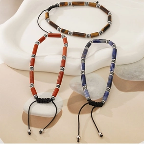 Detailed set of cylindrical tiger eye, red jasper and sodalite woven beaded bracelets