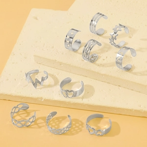 Collection of silver stainless steel rings with star and heart designs on stone