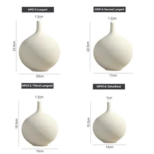 Set of four modern white ceramic vases with detailed horizontal spiral textures in grid view