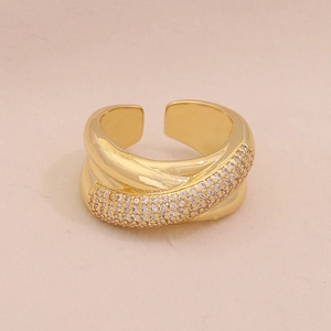 Detail view of multi-layered gold ring with sparkling pavé zircons and adjustable band