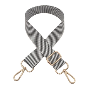 Detail of adjustable black and white striped canvas strap with gold swivel hooks