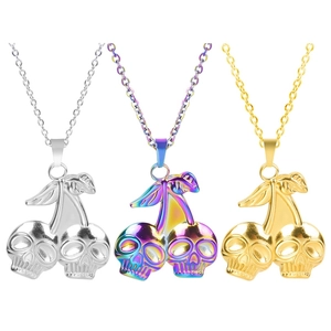 Detailed view of skull cherry pendants in silver, rainbow, and gold 18k plated finishes