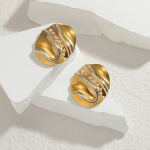 Minimalist 18K gold plated stainless steel stud earrings with pearls on a white stone