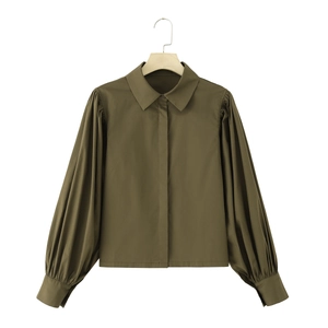 Detail of army green poplin shirt with puffed lantern sleeves and wide cuffs