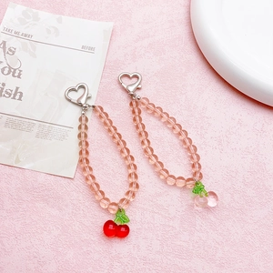 Pink translucent beaded phone charm with cherry pendant and heart metal clasp