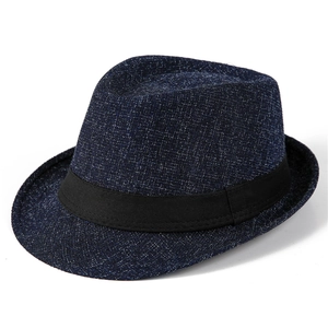 Close-up of navy blue woven fedora hat texture with classic black fabric band detail