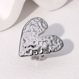 Polished silver heart ring with molten lava texture and artistic chunky design