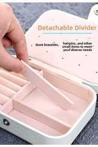 Detail of mint green PU leather jewelry box with removable dividers and ring slots