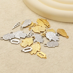 Golden and silver stainless steel Fatima hand, feather, and blade charms for DIY jewelry