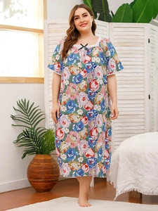 Detailed view of floral nightdress featuring white lace neckline and small black bow