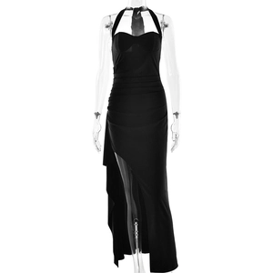 Close-up of black halter neck dress featuring a high side slit and sleek backless design