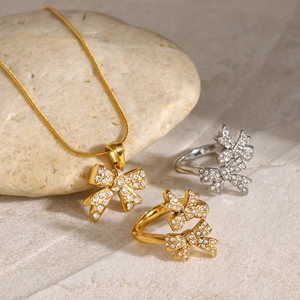 French vintage 18K gold bow pendant necklace and rhinestone bow rings set