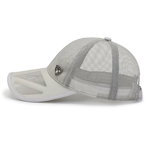 Close-up of grey and white mesh baseball cap featuring a silver Red Eagle metal badge
