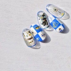 Golden Egyptian nail stickers with black cats, pyramids and ankh symbols on clear base