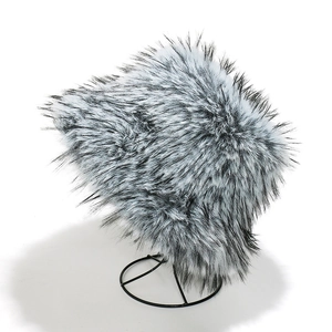 Close-up of thick gradient faux fox fur texture on a warm winter bucket hat for women