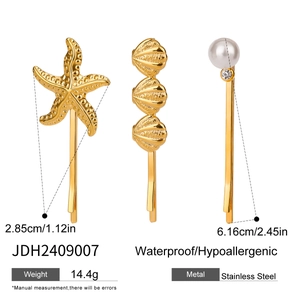 Lot de trois barrettes en acier inoxydable doré avec étoile de mer coquillage et perle