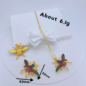 Golden insect beetle pendants with colorful zircons, size 33-41mm, weighing about 6.1g