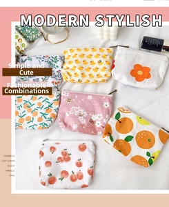 Collection of mini floral canvas coin purses with metal zippers and cute fruit prints