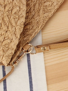 Woven straw bag for women, featuring detailed hardware and textured weave for daily summer style.