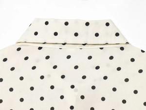 Detail of vintage polka dot collar and woven fabric on this long button-up shirt