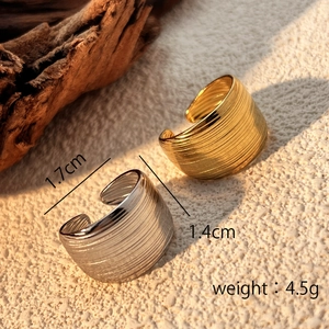 Polished stainless steel open ring with textured surface in gold and silver finishes