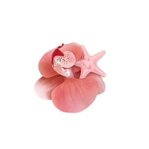 Pink orchid hair clip with starfish and pearl accent for elegant beach vacation hairstyles