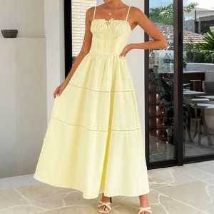 Pale yellow camisole maxi dress with ruched bodice, lace tiers and tied neckline detail