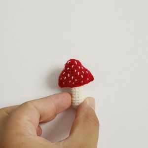 Handmade crochet red and beige mushroom brooch pins crafted from soft cashmere wool yarn