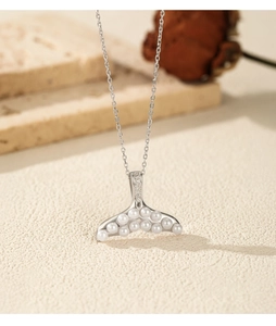 Detailed view of S925 silver mermaid tail pendant with pearls and zircon stones