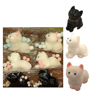Cute flocked cat squishy toy with blue eyes and pearl necklace in black and white