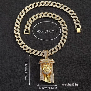 Detail of hip hop gold plated Jesus pendant necklace with rhinestones and Cuban chain