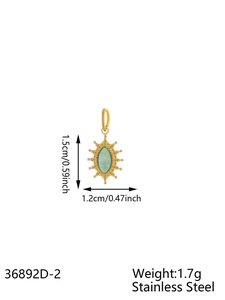 Detail of vintage gold stainless steel star pendant with light green marquise stone