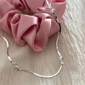 Elegant 925 sterling silver snake chain necklace with multiple bowknot charms and metallic shine