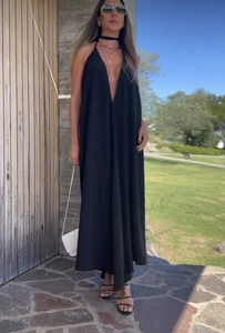 Detail of a black V-neck halter maxi dress featuring a flowing silhouette for beach vacations