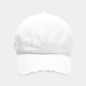 Close-up of distressed brim details on a classic white cotton baseball cap with torn edges