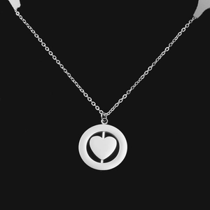 Detailed view of silver rotatable double-layer circular pendant with heart design