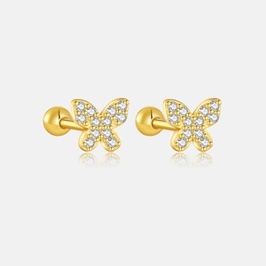Macro view of butterfly stud earrings with sparkling zircons and gold screw-back detail
