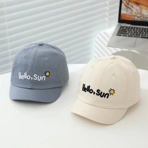 Detail of embroidered 'Hello Sun' logo on soft cotton toddler baseball caps