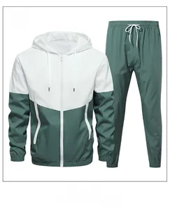 Detail of green and white color-block tracksuit featuring a hooded jacket and jogger pants