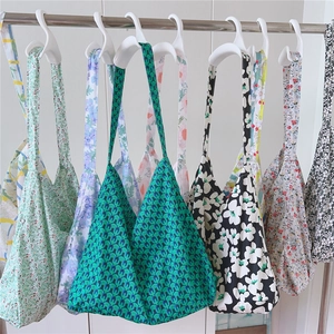 Collection of green and floral print cotton tote bags with wide shoulder straps