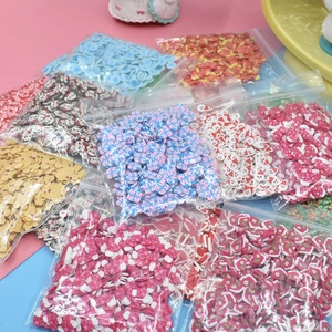 Colorful Christmas polymer clay slices set with gingerbread man and snowflake patterns