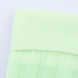 Pleated casual skirt in light mint green chiffon fabric with breathable texture detail