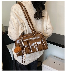Brown vintage faux leather pillow bag with double front pockets and puppy charm