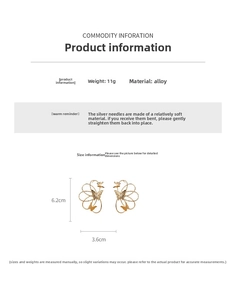 Detail view of gold butterfly drop earrings featuring hollow design and S925 silver pins