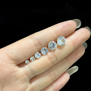 Size comparison of sparkling round cubic zirconia studs in gold prong settings
